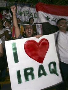 Fans celebrate Iraq`s victory over Saudi Arabia after the final match at the 2007 AFC Asian Cup soccer tournament