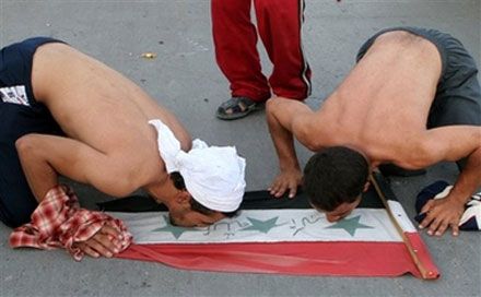 Fans celebrate Iraq`s victory over Saudi Arabia after the final match at the 2007 AFC Asian Cup soccer tournament
