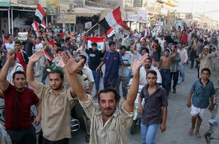 Fans celebrate Iraq`s victory over Saudi Arabia after the final match at the 2007 AFC Asian Cup soccer tournament