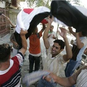 Fans celebrate Iraq`s victory over Saudi Arabia after the final match at the 2007 AFC Asian Cup soccer tournament