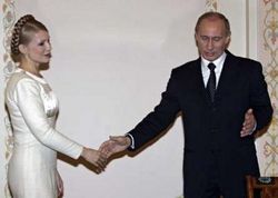 Юлия Тимошенко и Владимир Путин. Фото Reuters