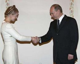 Юлия Тимошенко и Владимир Путин. Фото Reuters