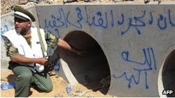 Omran al-Oweib said his men came under fire after they dragged Col Gaddafi from a drainage pipe