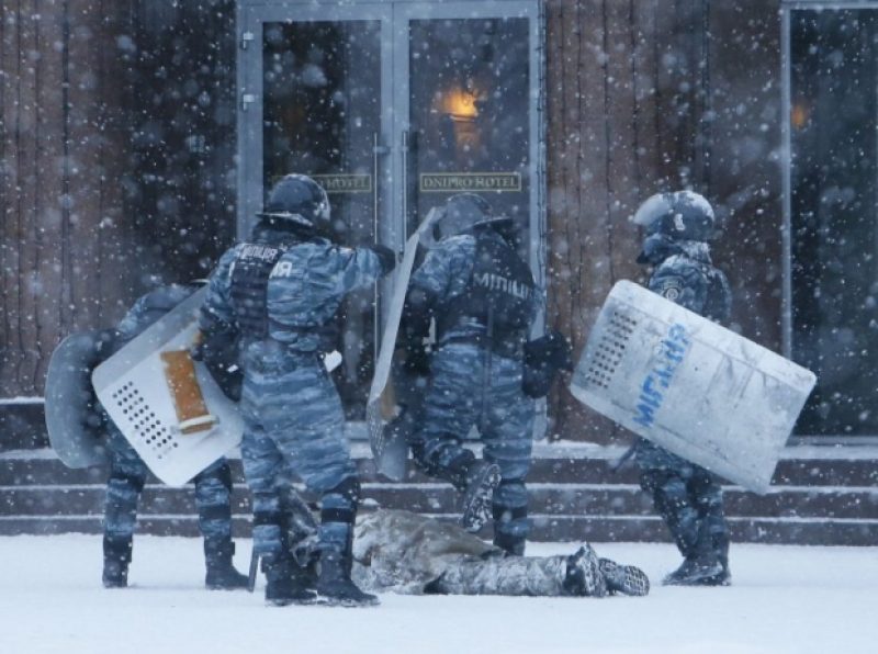 Berkut beating a protester
