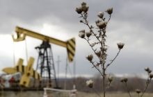 Oil gets cheaper, to $65.49 a barrel, on economic news