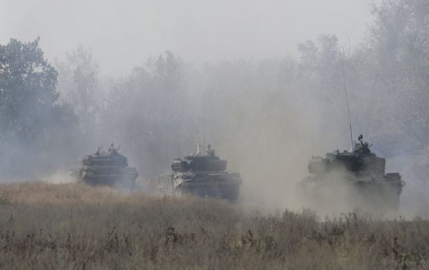 РФ отводит войска с позиций в Запорожской области / фото REUTERS РФ отводит войска с позиций в Запорожской области / фото REUTERS