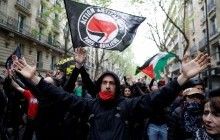 У Парижі акція проти "подруги Путіна" Ле Пен завершилася сутичками (фото, відео)
