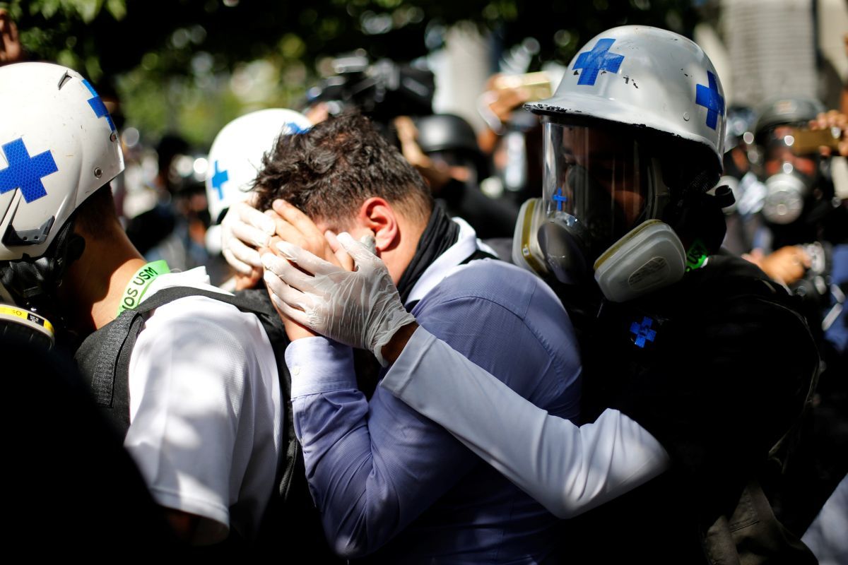 Пострадавший митингующий / REUTERS Пострадавший митингующий / REUTERS