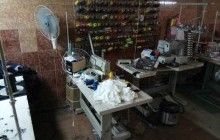 На Одещині накрили три цехи, де іноземці "штампували" підроблений брендовий одяг (фото)