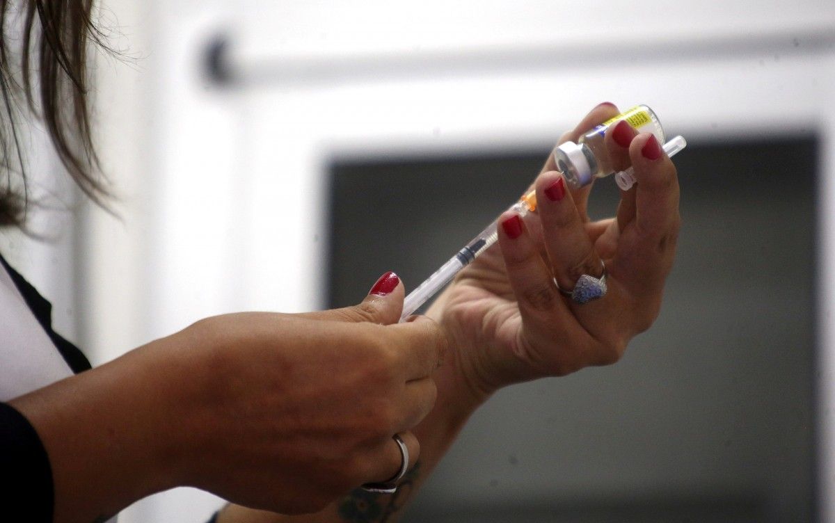 COVID-19 vaccination to kick off on February 15 / REUTERS
