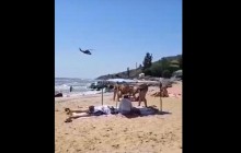 У Донецькій області військовий гелікоптер пролетів біля пляжу з відпочивальниками (відео)