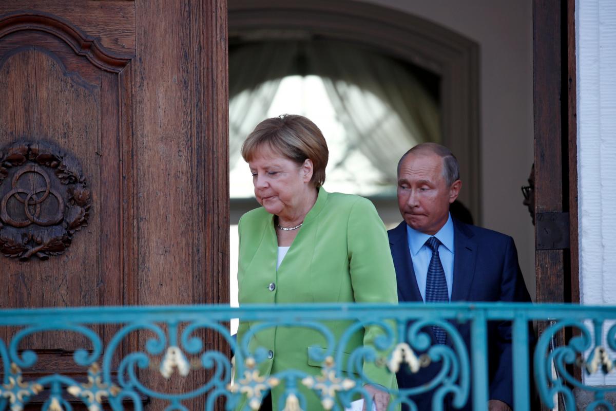 Владимир Путин и Ангела Меркель / Иллюстрация REUTERS