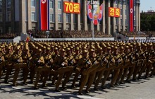 В КНДР военный парад состоялся без ядерных испытаний и ракет (фоторепортаж)