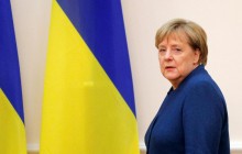 Merkel, Macron call for prisoner swap in Donbas, release of political prisoners by year-end
