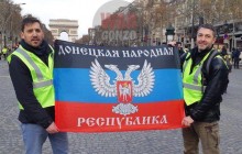 "Russian World" supporters fly "DPR" flag at yellow vest protest in Paris
