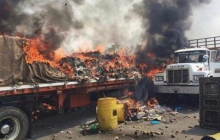 Venezuela's Guaido says "all options open" after soldiers set fire to aid convoys at border (Video)