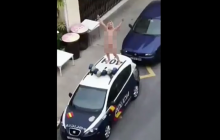 Испанка разделась и запрыгнула на полицейское авто в знак протеста против карантина (видео)