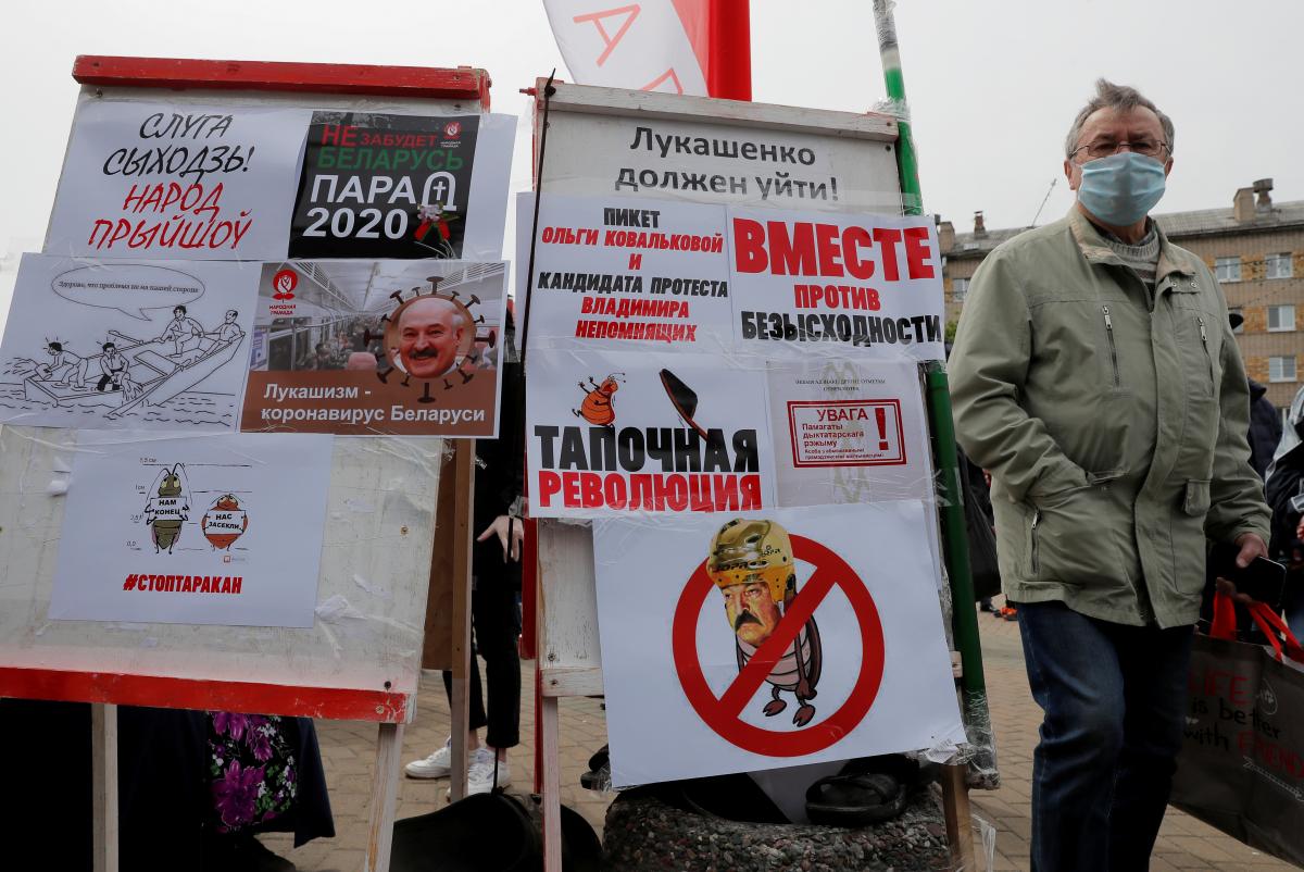 Участники акции в Минске / фото REUTERS Участники акции в Минске / фото REUTERS