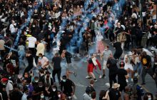 20-тысячный митинг в Париже закончился беспорядками, полиция применила слезоточивый газ (фоторепортаж)