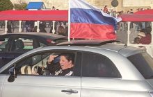 На підтримку звірств РФ: у Греції та Німеччині відбулися автопробіги з триколором (відео)