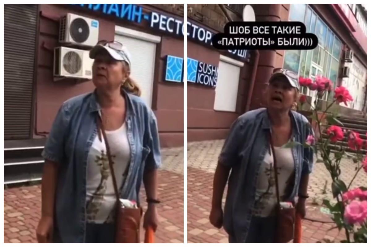 Жінка штовхала художника, він міг впасти з драбини / скріншоти з відео Жінка штовхала художника, він міг впасти з драбини / скріншоти з відео