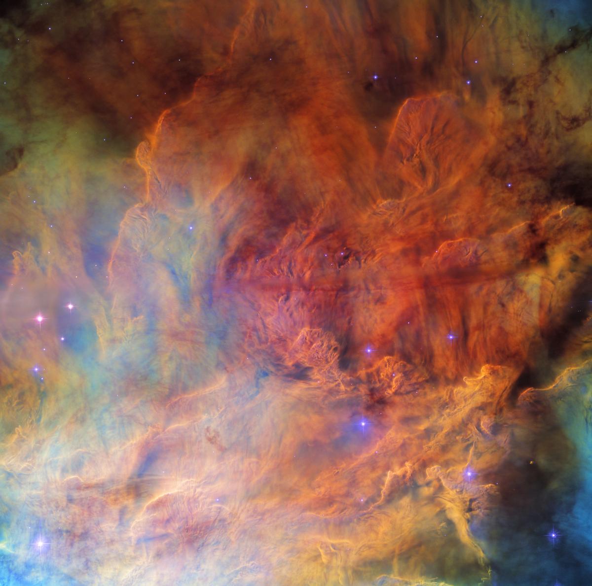 Хмари газу покривають усе зображення яскравими кольорами / фото ESA/Hubble & NASA, ESO, O. De Marco Хмари газу покривають усе зображення яскравими кольорами / фото ESA/Hubble & NASA, ESO, O. De Marco