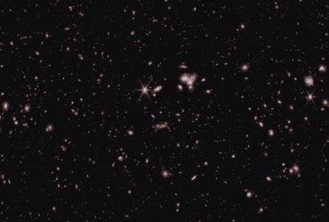 Телескоп Уэбба обнаружил самую далекую активную сверхмассивную черную дыру