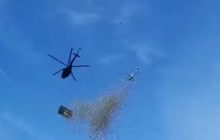 Люди в пакети збирали гроші: у Чехії скинули мільйон доларів з гелікоптера (відео)