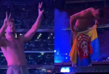 Фронтмен Imagine Dragons на концерте поцеловал флаг 122-й бригады ТрО и показал знак победы (видео)